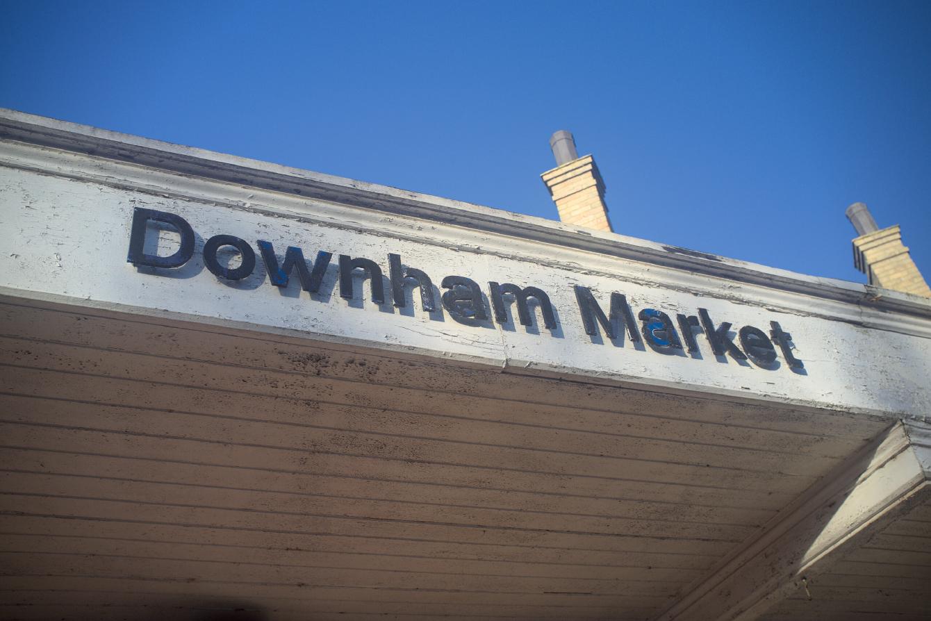 The text on the canopy of Downham Market station, written in individually-cut Rail Alphabet letters.