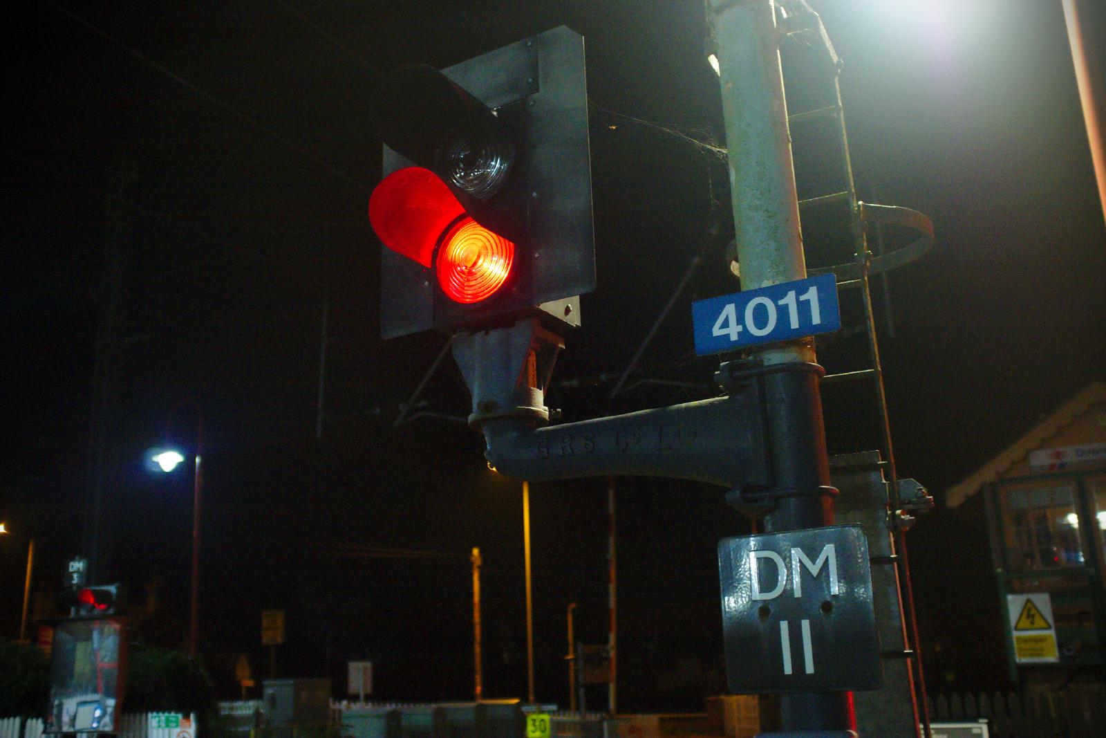 The signal DM11 at Downham Market station showing a danger aspect (red).
