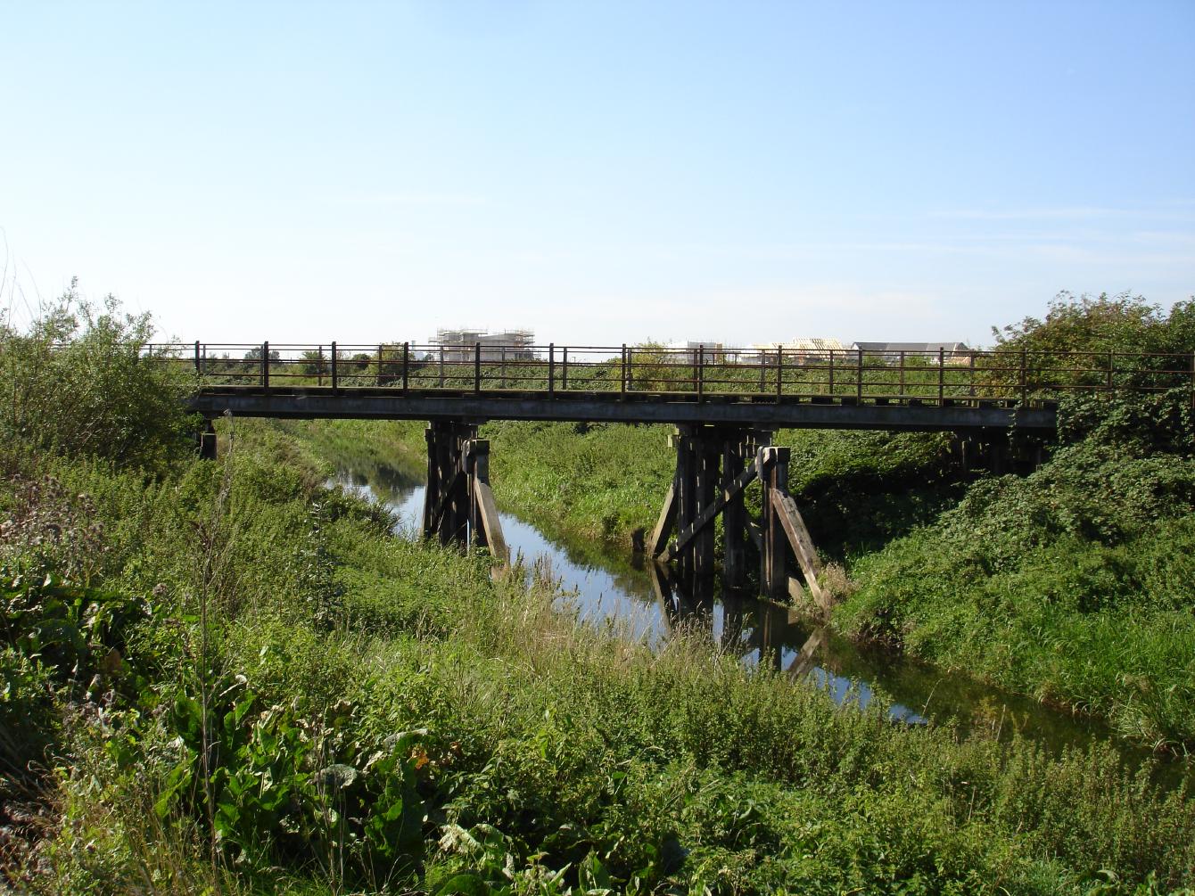 The &ldquo;Casey Jones&rdquo; bridge over the River Nar. It is of mostly wooden construction, with a steel deck and steel railings.