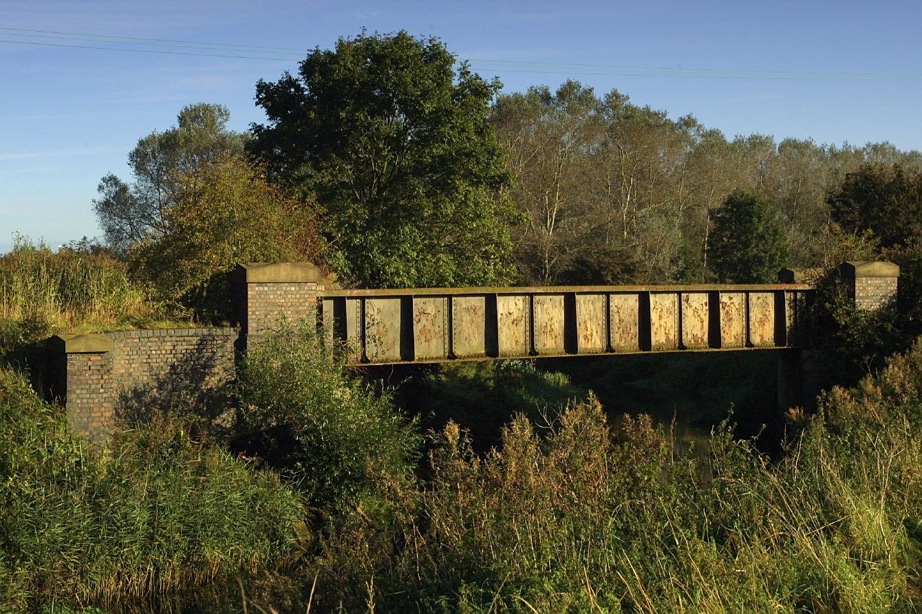 A look at the side of the bridge; it is a girder bridge with visible brick abutments.