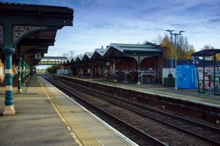 A view from platform 2 at march, looking along the length of the station. The canopy's distinctive zig-zag style is visible. Wrought iron supports the canopies.