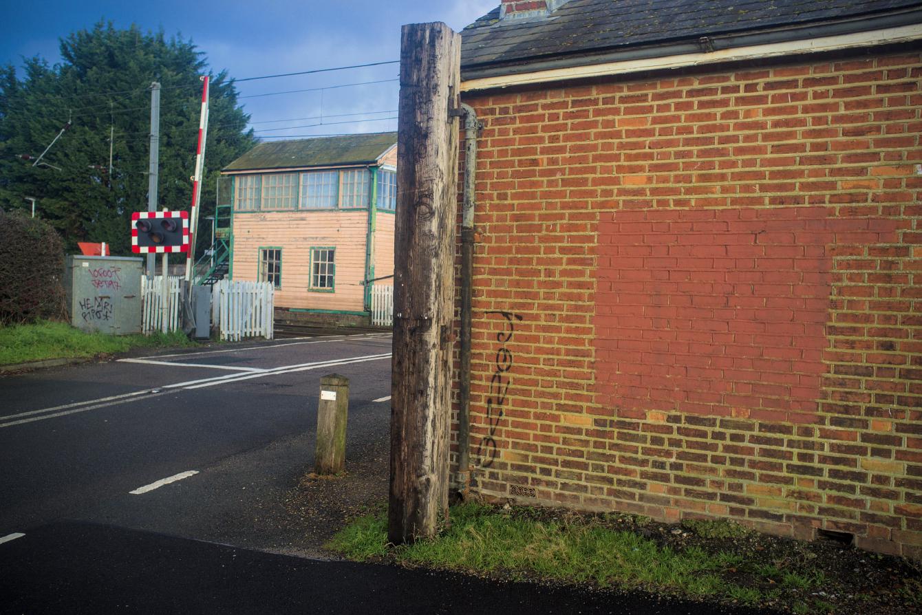 A wooden gatepost, about 20cm thick.