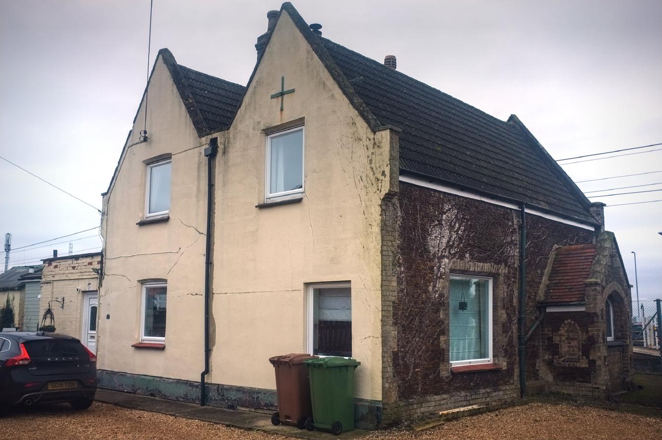 An old station house; it is mostly of carrstone construction, with a rendered wall.