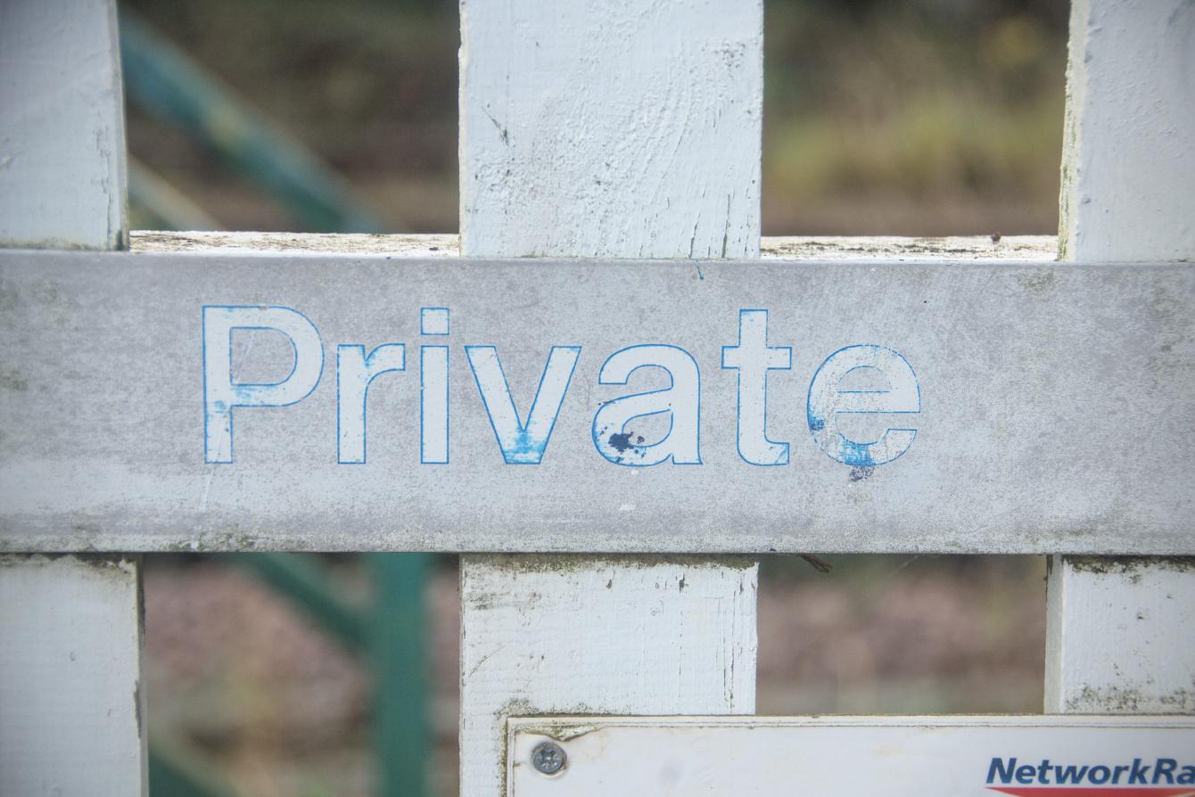A faded sign saying &ldquo;Private&rdquo; in the standard British Rail typeface.