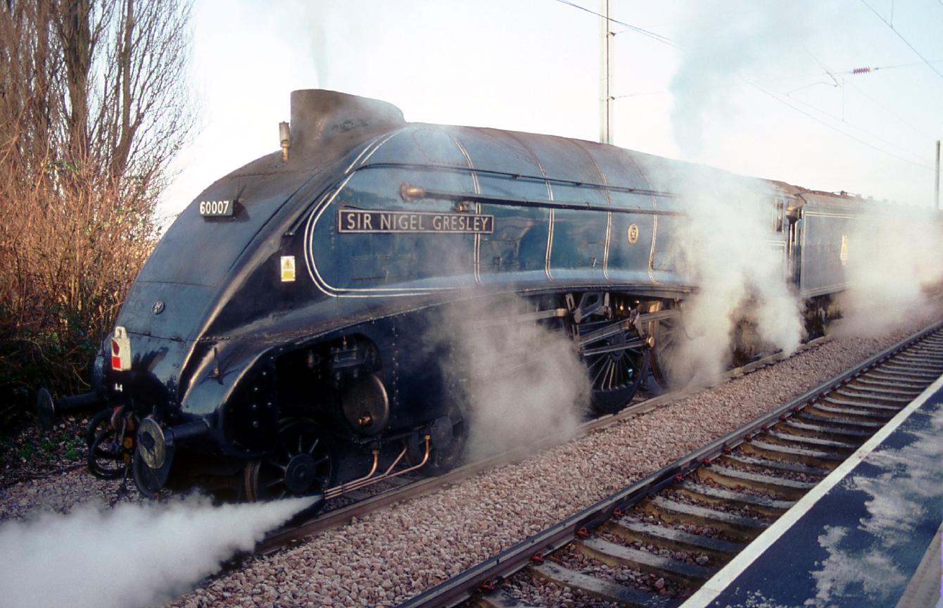 The locomotive Sir Nigel Gresley waits on the track opposite platform 1 at Watlington.